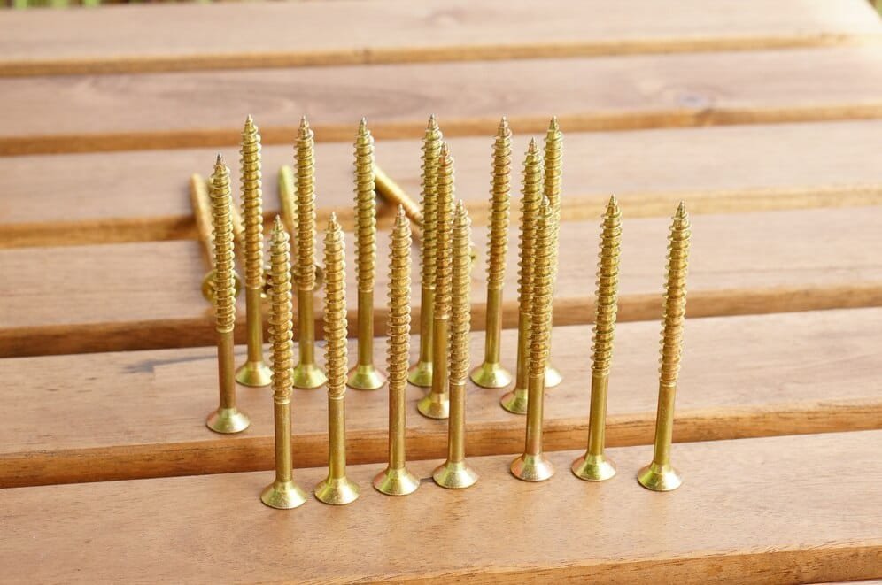 6 Self-drilling screws in Hyderabad closeup shot golden cross screws golden table 181624 18665